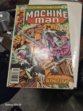 Marvel Machine Man Comic Cover with Pink, Orange and Yellow Artwork